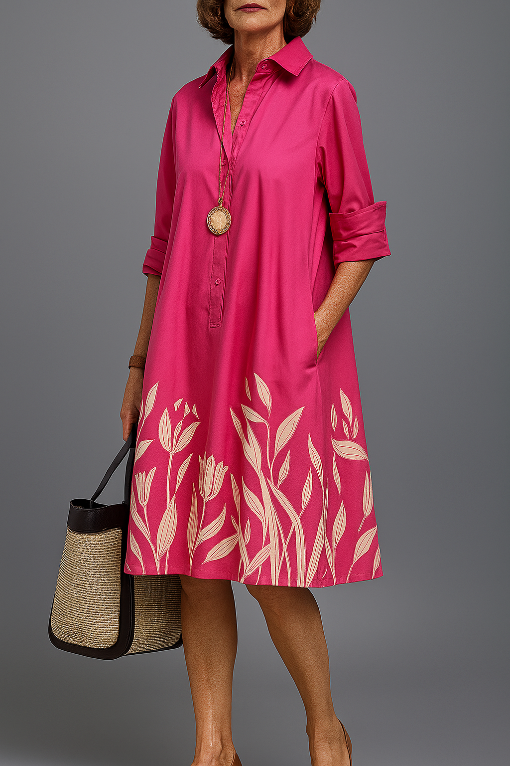 Elegant women's pink floral midi shirt dress. Vibrant A-line design, perfect for spring brunch or daytime wear.