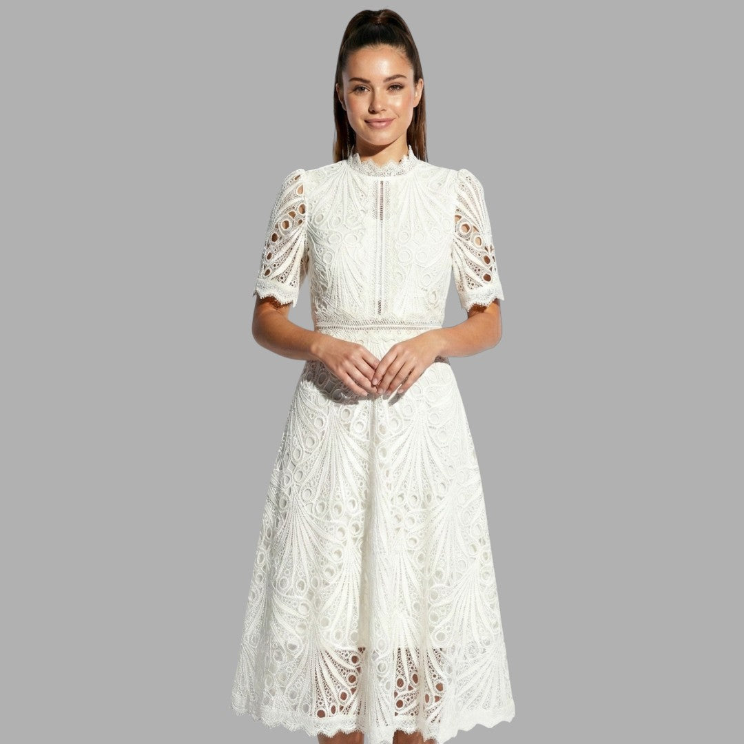 Sophisticated white lace midi dress for women. High neck, short sleeves. Ideal for elegant special occasion events.
