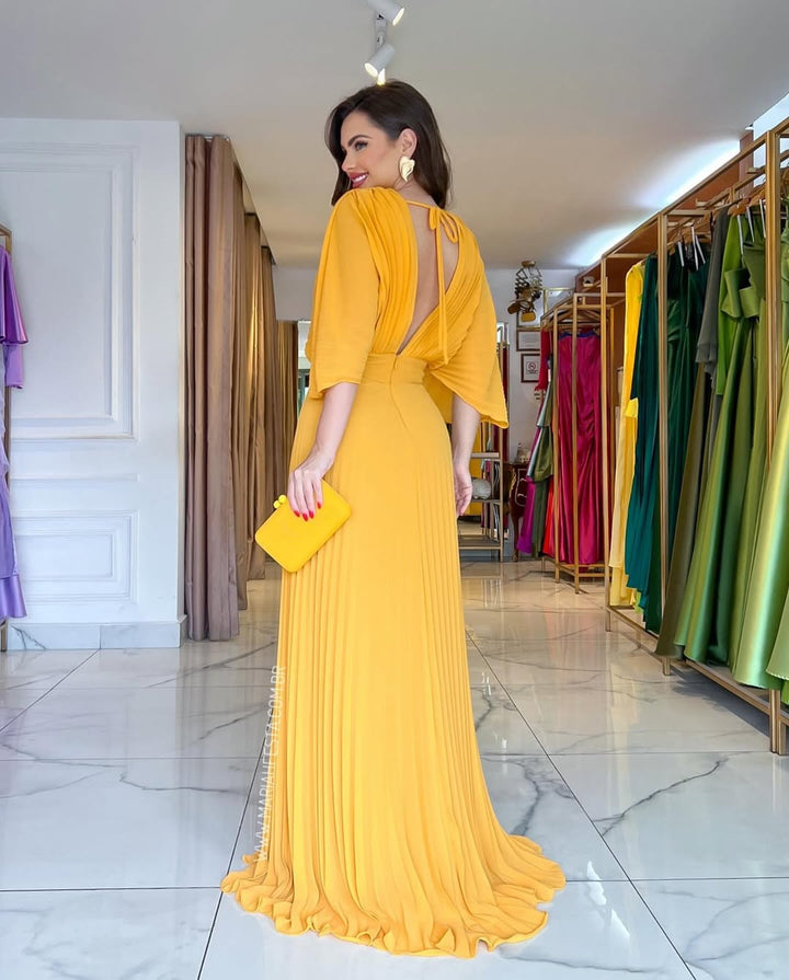 Gorgeous women's formal pleated maxi gown with chic batwing sleeves, suitable for any elegant event.