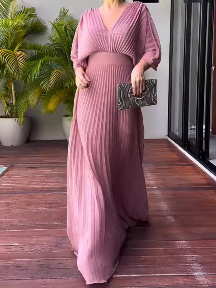 Sophisticated women's special occasion dress: pleated maxi with elegant batwing sleeves for events.