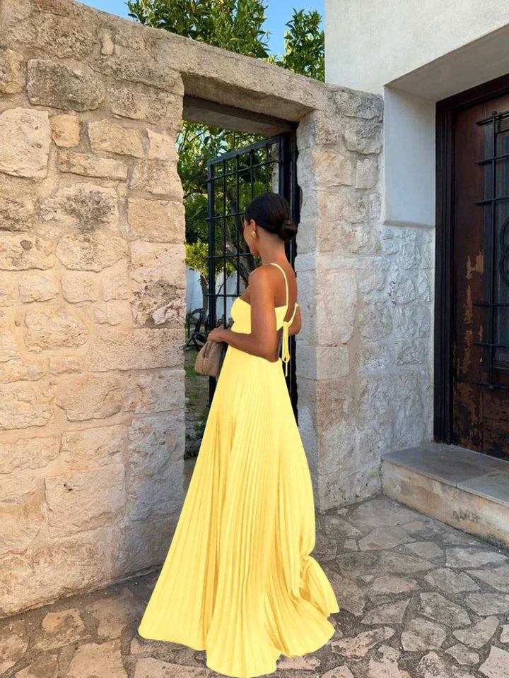 Beautiful women's pleated halter maxi dress, a chic and formal evening gown for special occasion events.
