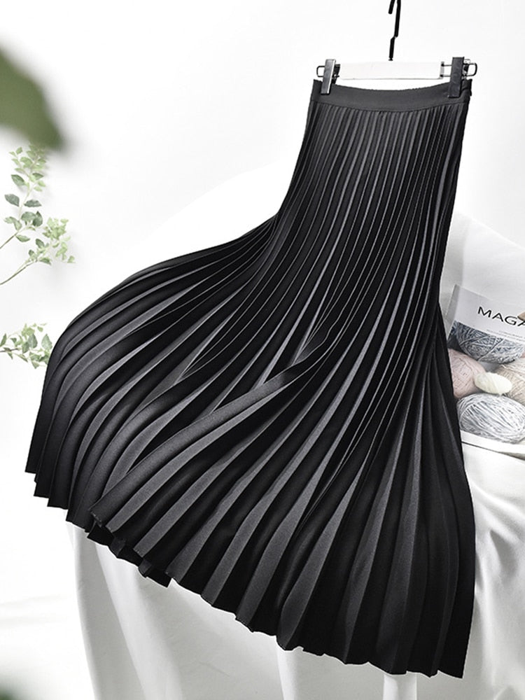 Elegant women's pleated high waist midi skirt. Chic fashion bottom, versatile for any wardrobe.
