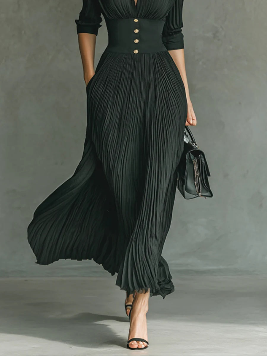 Women's elegant pleated maxi dress with a lapel collar & flattering belted waist, suitable for any chic outfit.