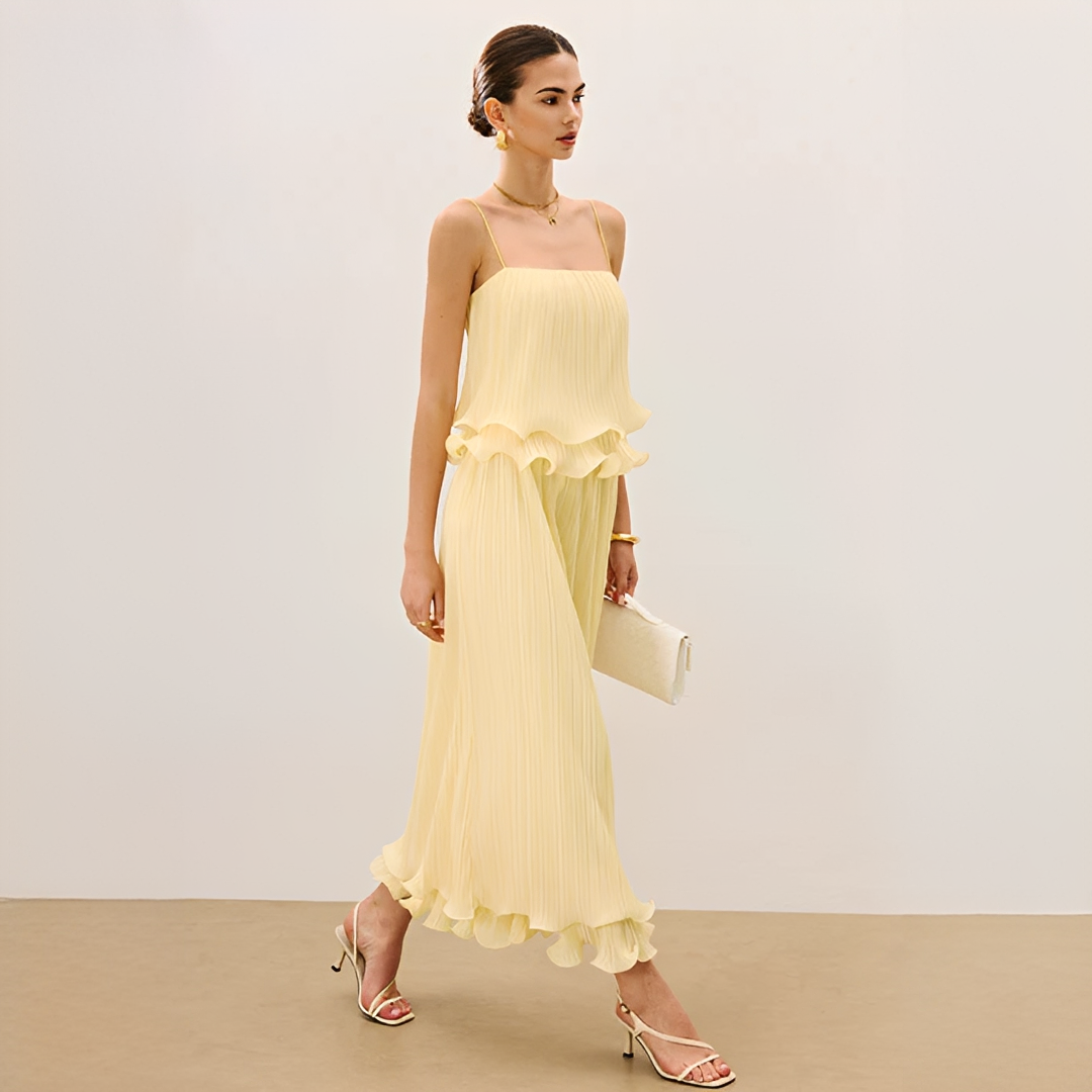 Elegant women's pleated maxi co-ord set with ruffle detail. Chic two-piece summer party dress with spaghetti straps.