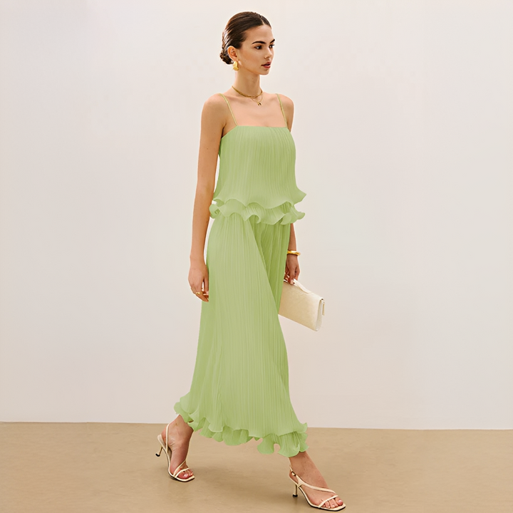 Beautiful women's pleated maxi co-ord set featuring delicate ruffle details. Flowy elegant two-piece for summer events.