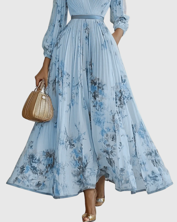 Pleated V-neck maxi dress for women, featuring long sleeves and a stunning floral print.