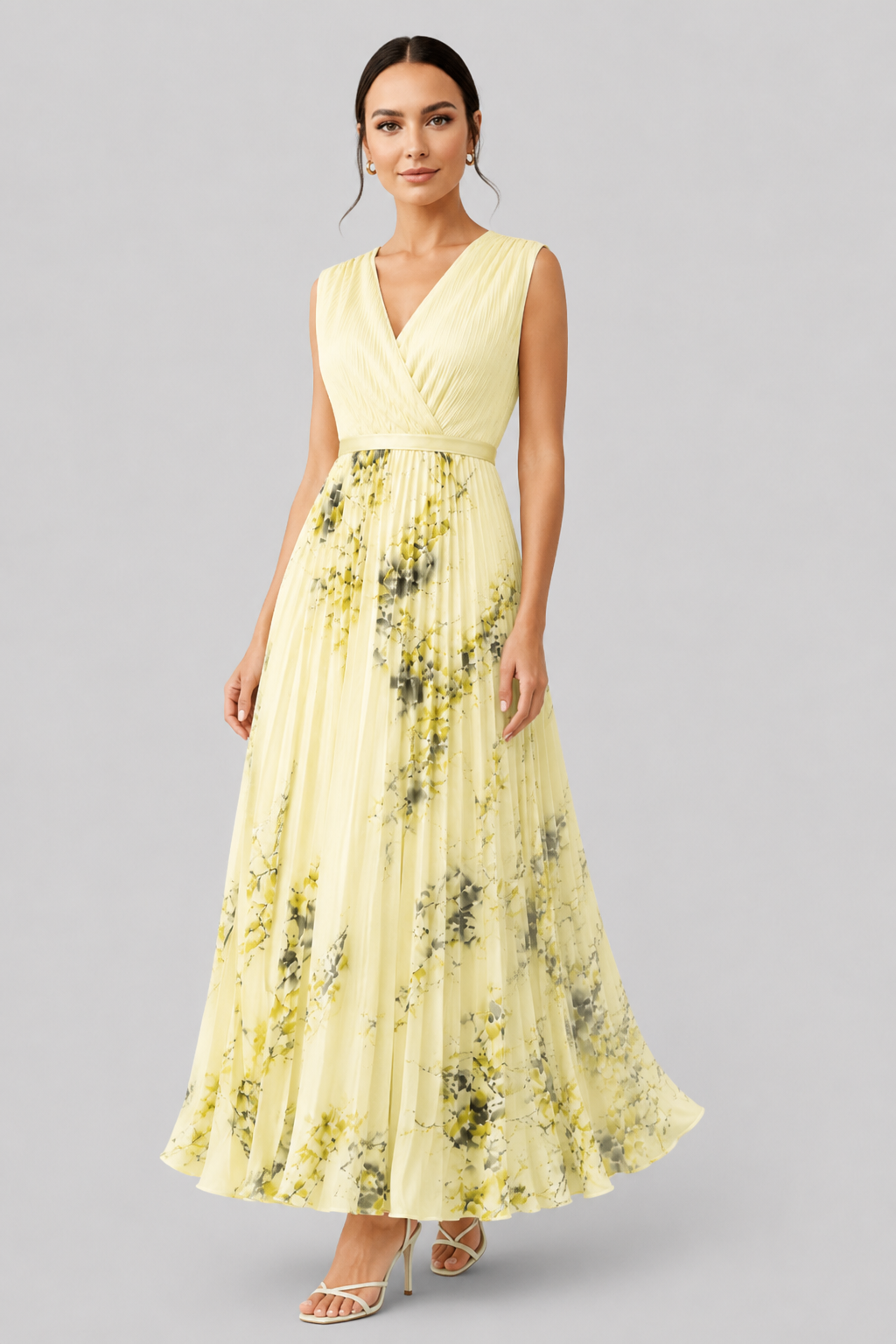 Modern women's elegant sleeveless maxi dress with a V-neck, flowy pleats, and stylish waist tie.