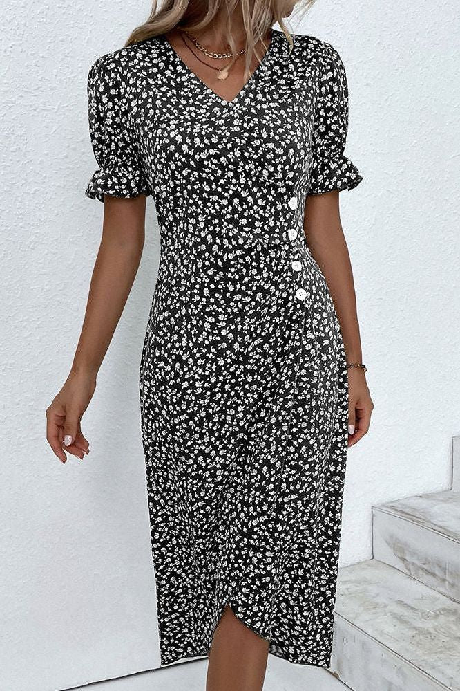 Back view of elegant women's pleated midi dress, emphasizing its comfortable, flowy silhouette.