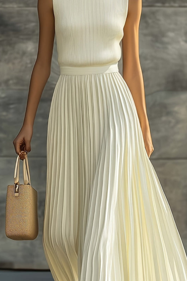 Flowing sleeveless women's midi dress with elegant pleats, perfect for casual summer days or versatile wear.