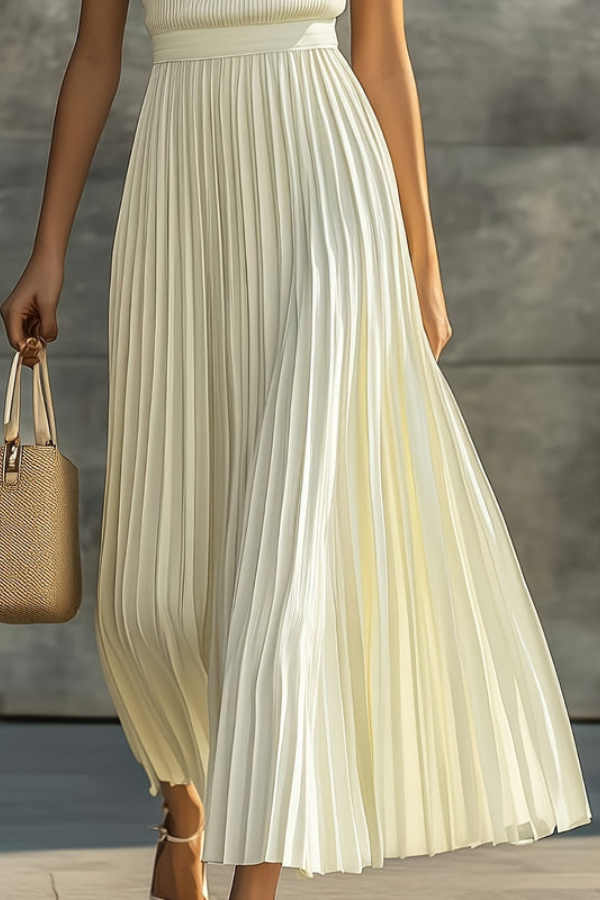 Women's elegant sleeveless midi dress, featuring beautiful pleats and a flowing design for summer fashion.