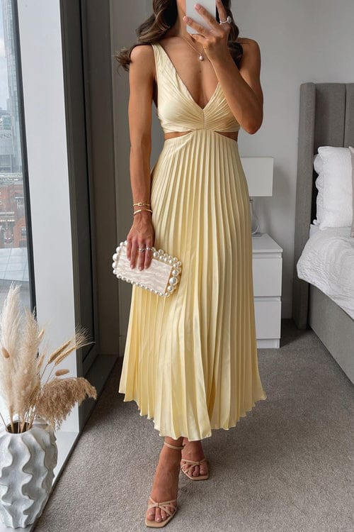 Elegant women's pleated midi dress with flowing design, perfect for evening or party wear.