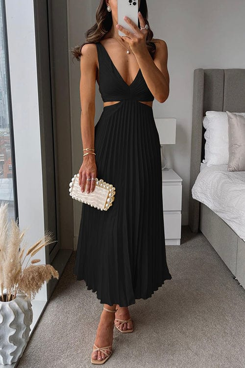 Sophisticated women's pleated midi dress with an elegant, flowing silhouette, suitable for evening wear.