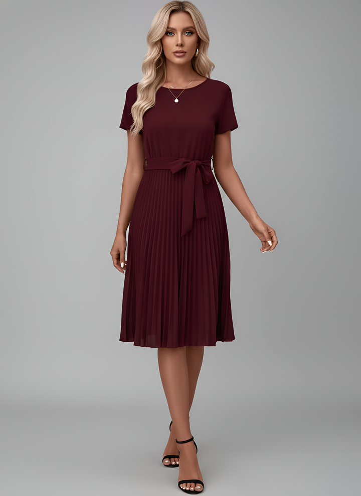 Chic women's belted pleated midi dress, ideal for spring/summer casual wear or a smart office look.