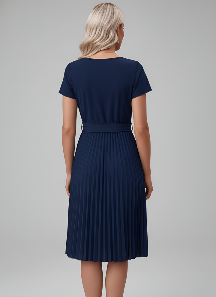 Classic women's pleated midi dress with short sleeves & belt. A chic choice for any casual or professional setting.