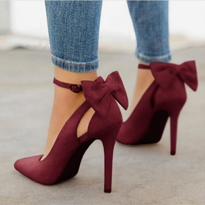Classic women's high heel court shoes with pointed toe & bow, ideal for evening parties & professional wear.