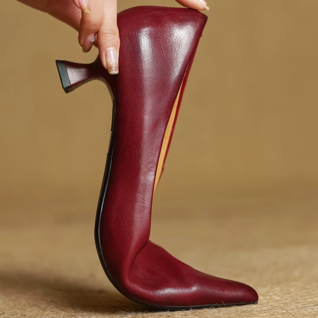 Sophisticated women's formal pumps featuring a sharp pointed toe & slender thin heel for professional style.