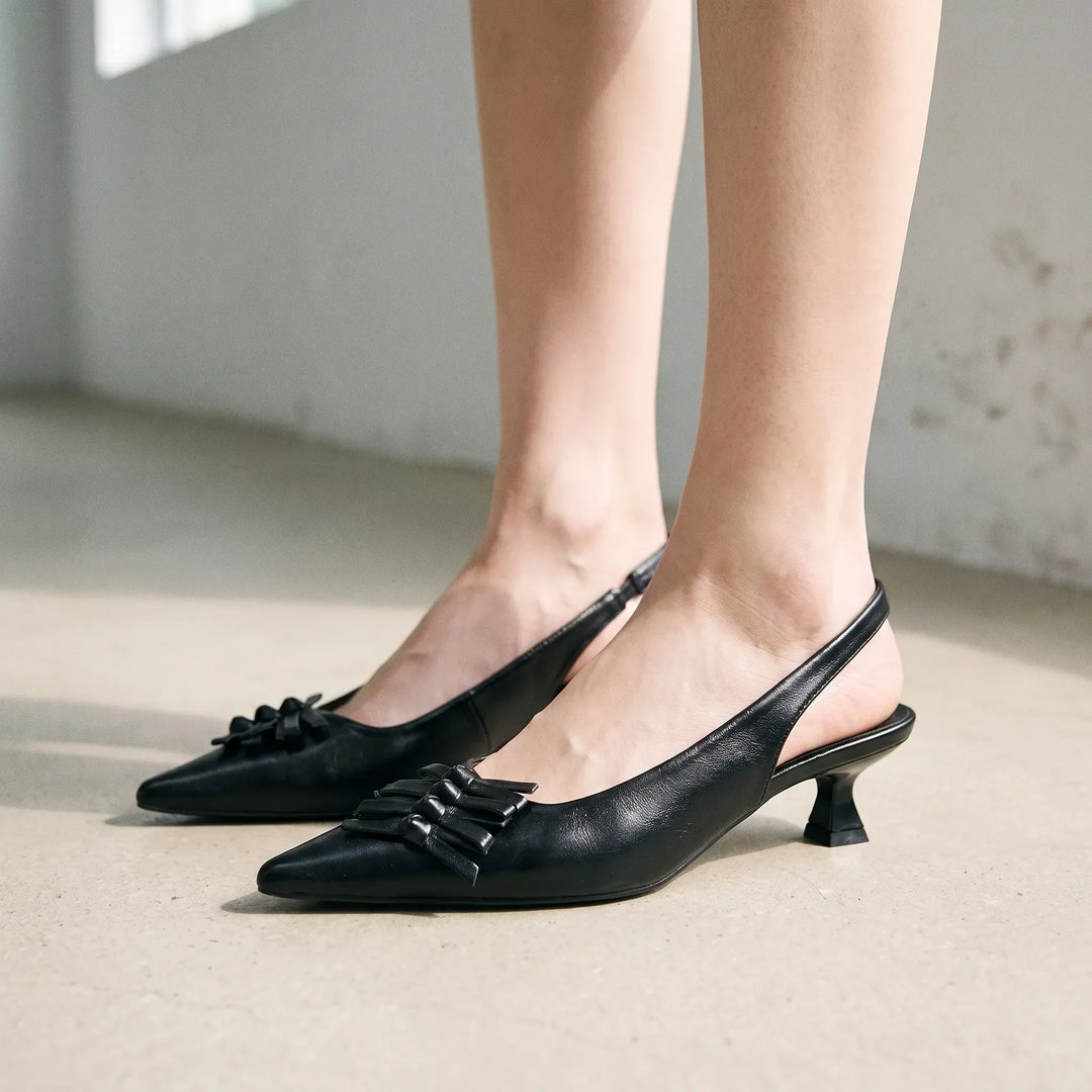 Elegant women's pointed-toe slingback heels, perfect for office wear or sophisticated evening events.