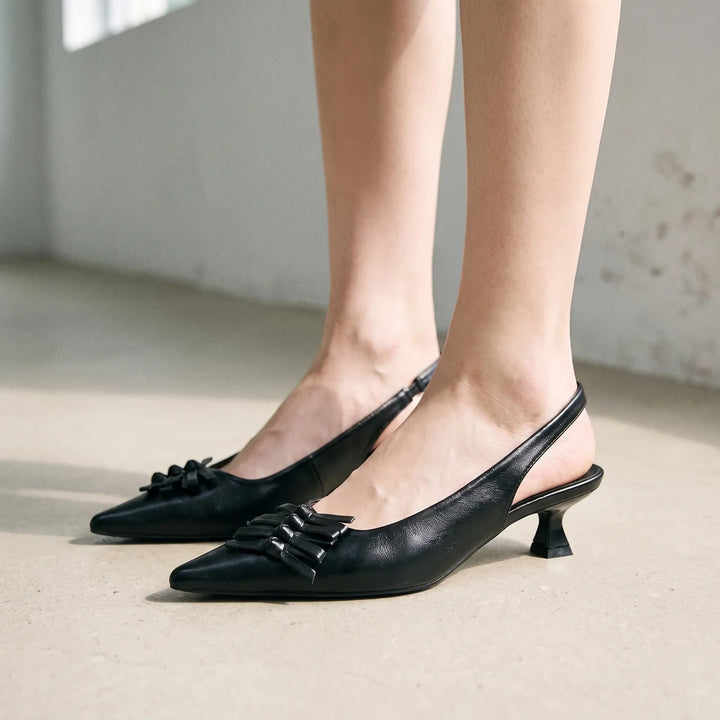 Elegant women's pointed-toe slingback heels, perfect for office wear or sophisticated evening events.