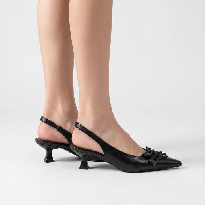 Chic women's pointed toe slingback heels. Versatile elegant footwear for professional office or formal evening attire.