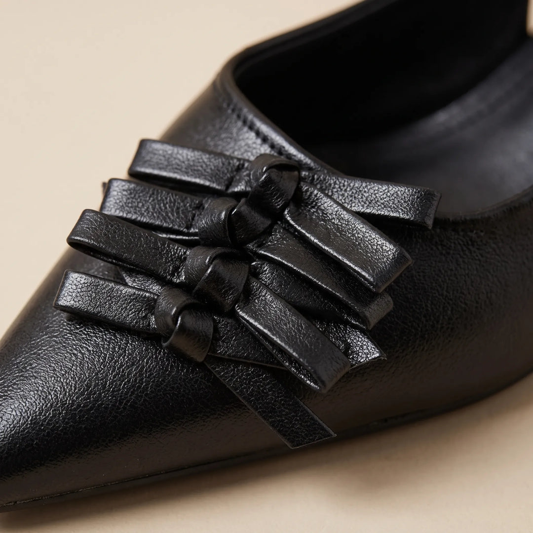 Classic pointed-toe slingback heels for women. Sleek and elegant, ideal for office and evening outfits.