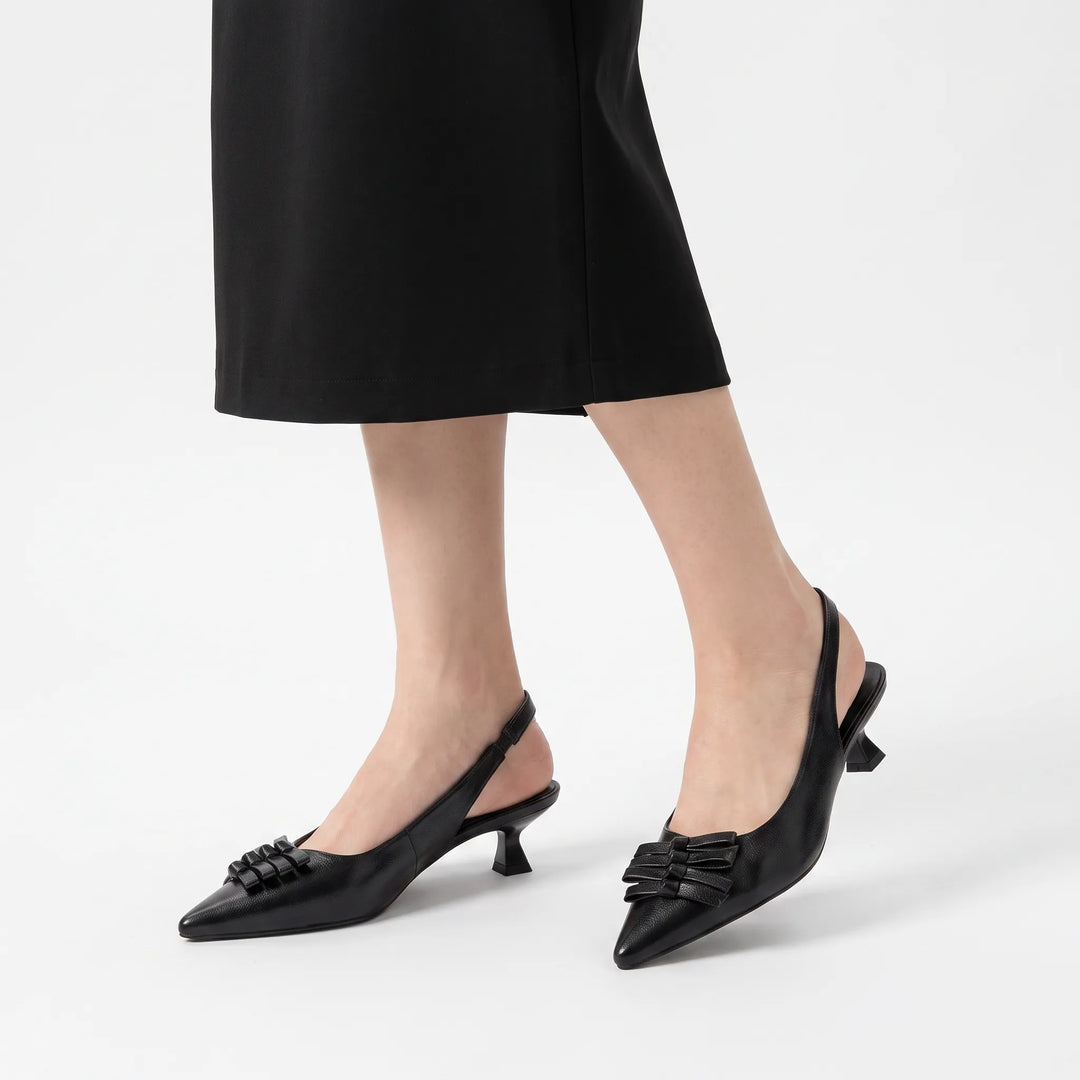 Sophisticated women's slingback heels with a sharp pointed toe, suitable for business or evening dress.