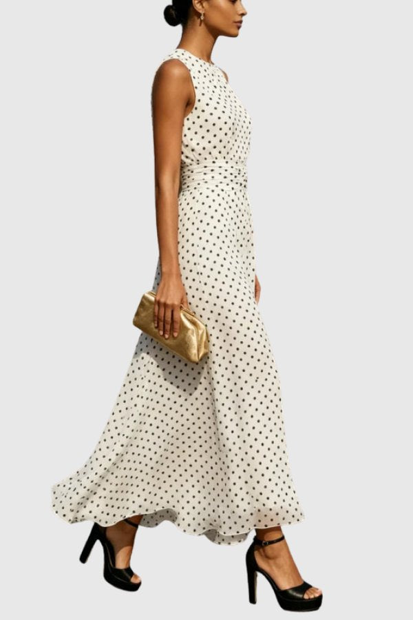Stylish women's polka dot maxi dress, elegant with a flowy ruffle hem, perfect as a sleeveless evening gown.