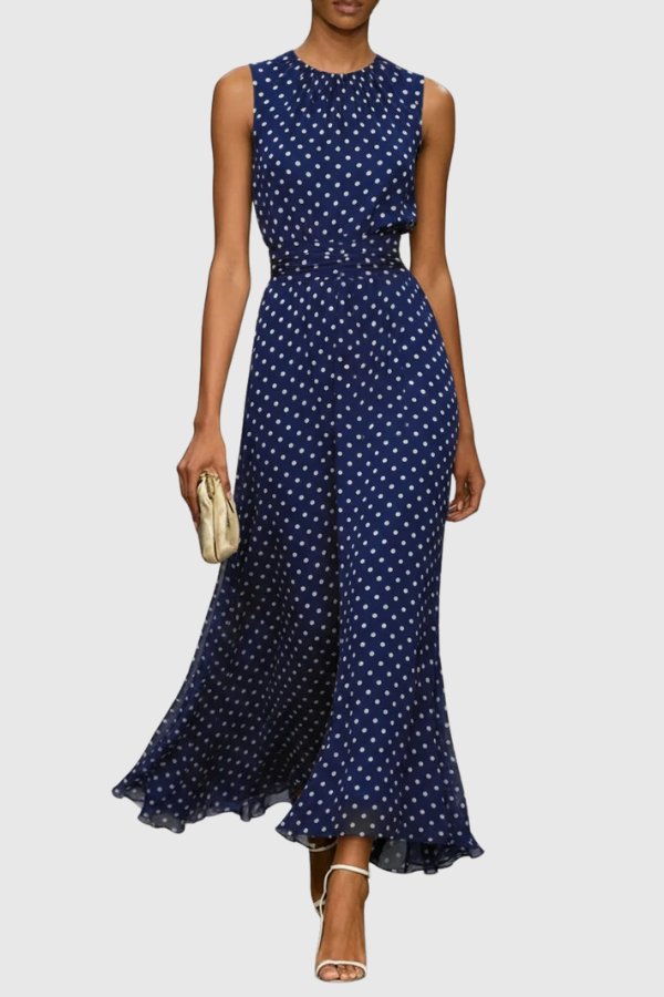 Full-length women's elegant polka dot maxi dress with a sophisticated ruffle hem, perfect for evening wear.