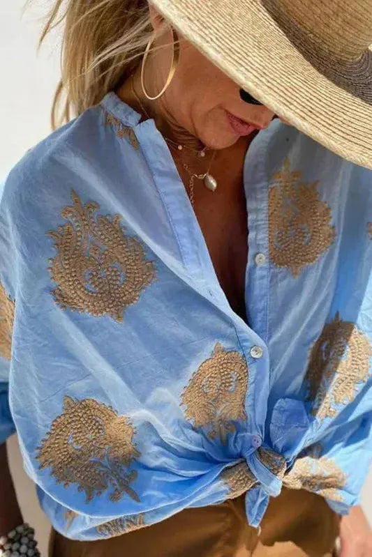 Stylish women's printed blouse, ideal for office workwear or everyday fashion. Comfortable & chic top.