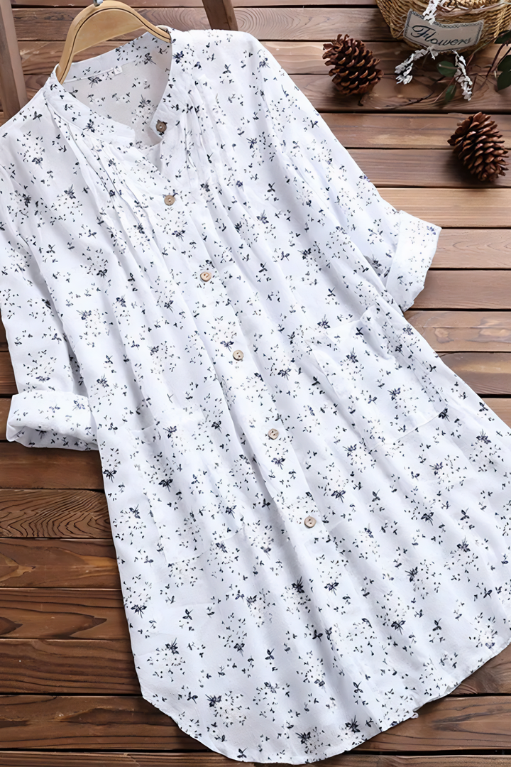 Elegant women's printed blouse with a relaxed fit, perfect for casual or office wear. Long sleeve chic top.