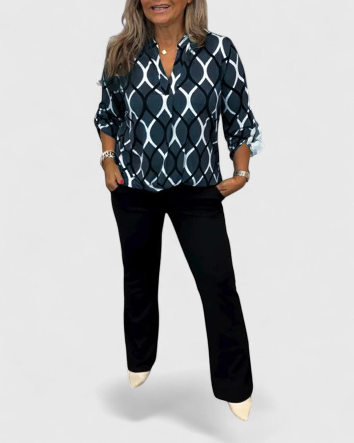 Elegant women's printed blouse with three-quarter sleeves, perfect for casual chic or versatile fashion.