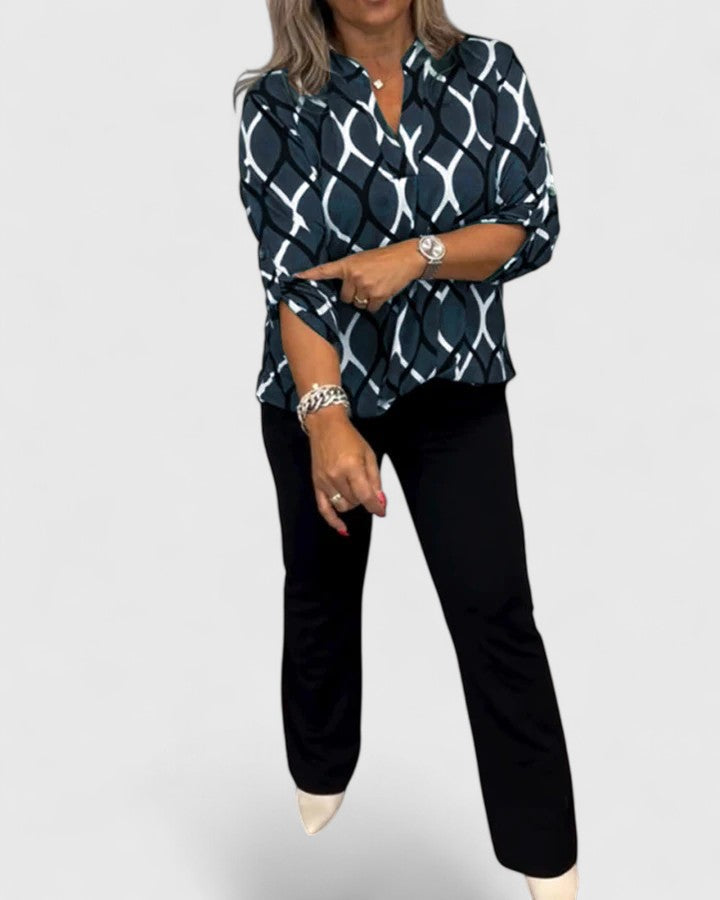 Comfortable women's printed top featuring unique designs & three-quarter sleeves for stylish everyday wear.