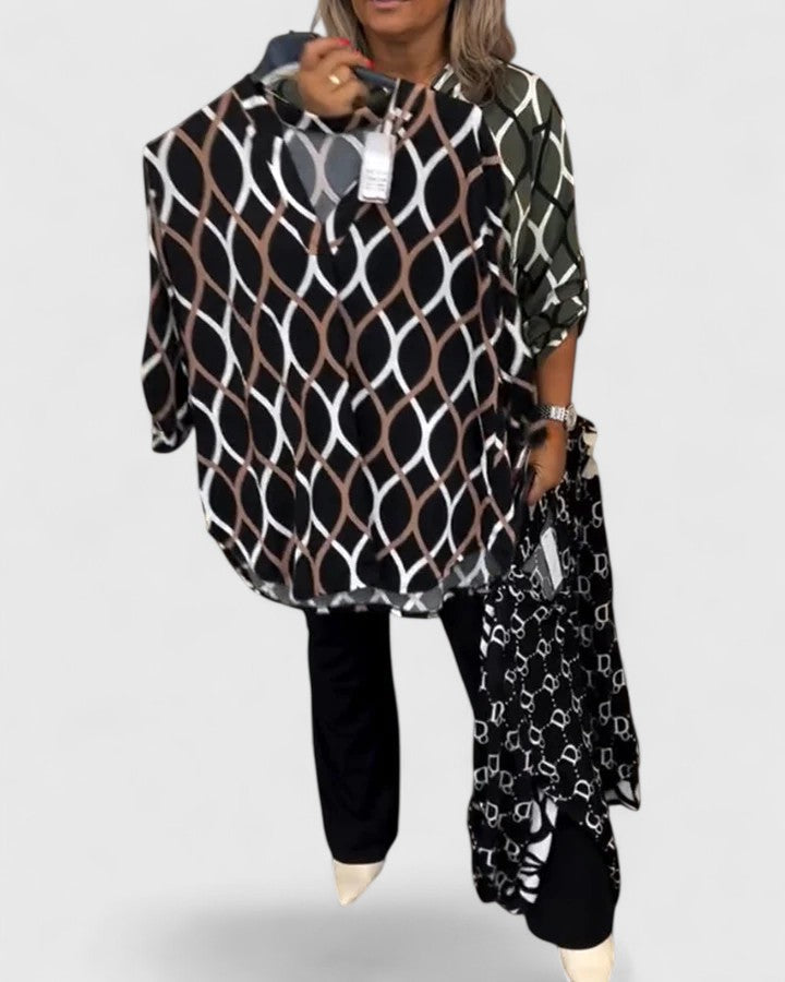 Stylish women's printed blouse with three-quarter sleeves, a versatile fashion top for various occasions.