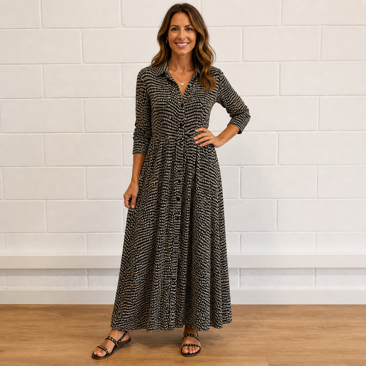 Elegant women's printed button-front maxi dress with long sleeves. Features a flowy silhouette for versatile style.