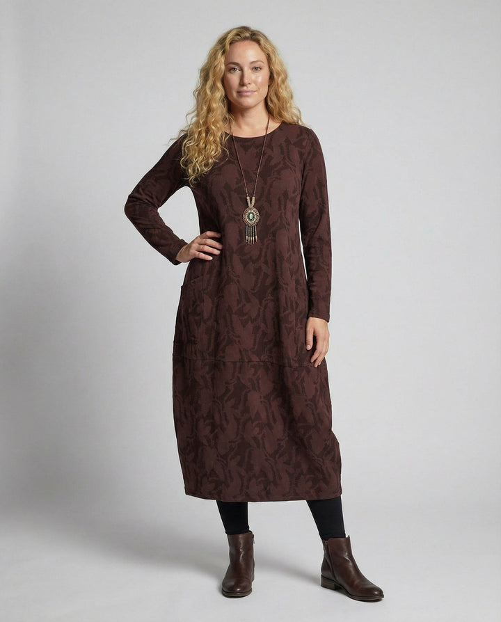 Elegant women's printed long-sleeve midi dress with pockets, perfect for versatile fall fashion.
