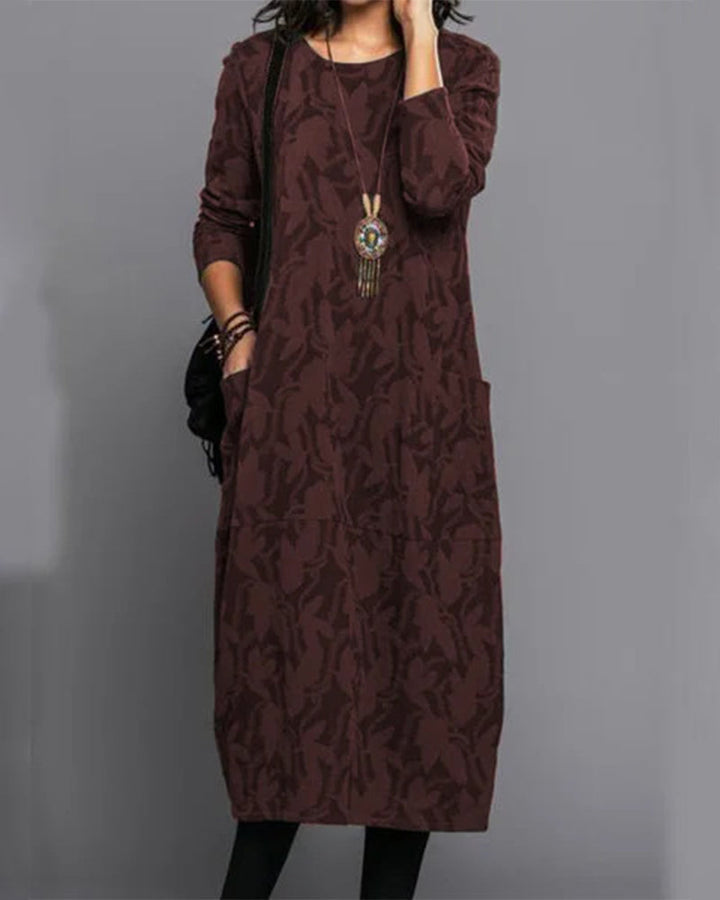 Women's elegant printed midi dress with long sleeves & functional pockets, ideal for fall casual style.