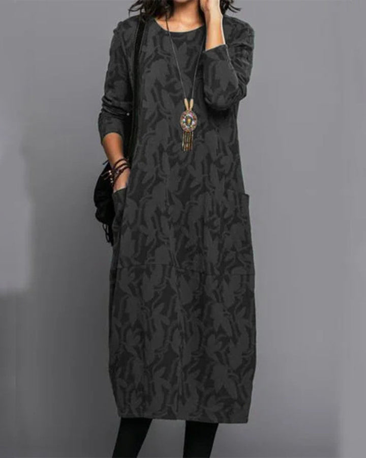 Comfortable & versatile women's long-sleeve midi dress, featuring an elegant print & practical pockets.