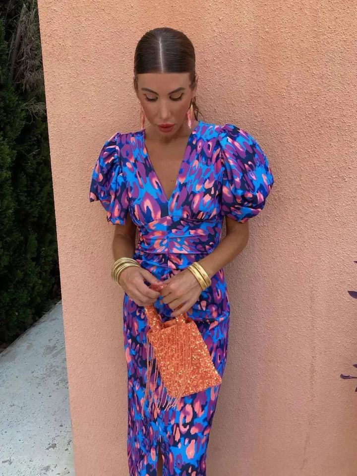 Chic women's puff sleeve V-neck maxi dress with elegant abstract print. Perfect for wedding guests & evening wear.