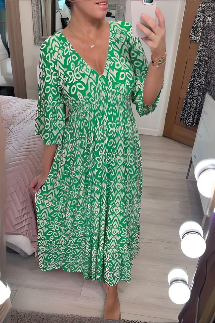 Fashionable women's printed midi dress, elegant with a defined, flattering waist for any event.