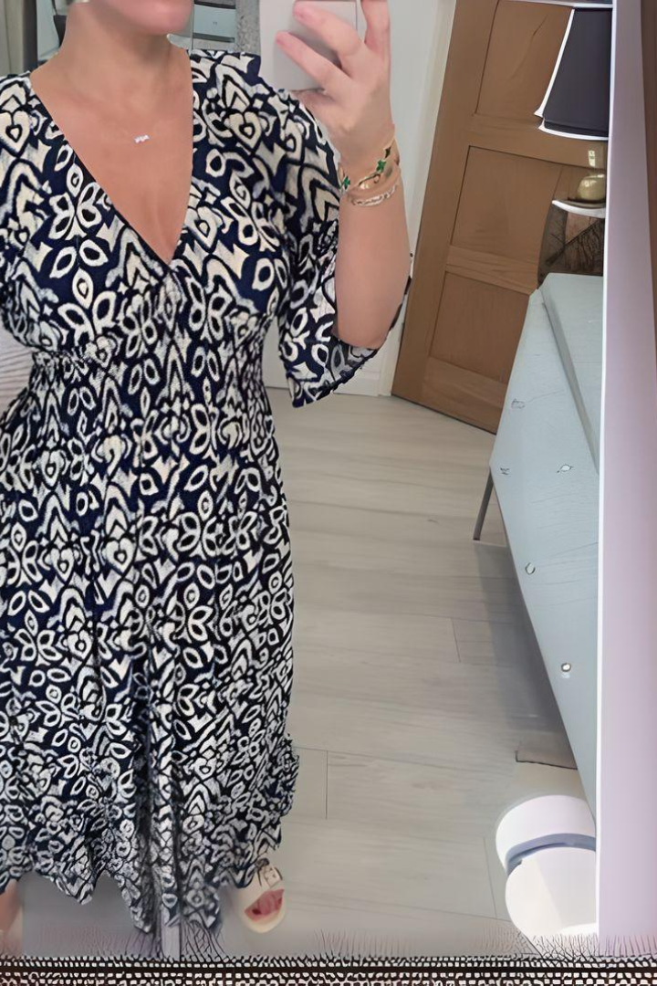 Stylish women's printed midi dress for spring, elegant and comfortable with a flattering defined waist.