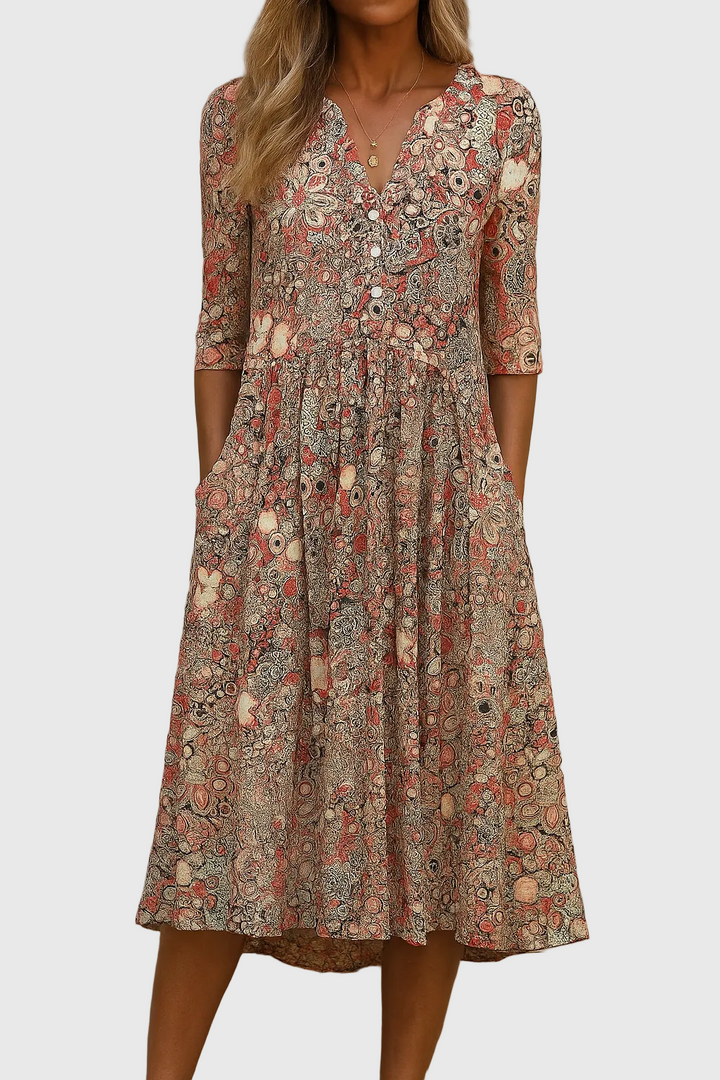 Elegant women's printed midi dress with V-neck, three-quarter sleeves & flowy skirt, perfect for summer/spring fashion.