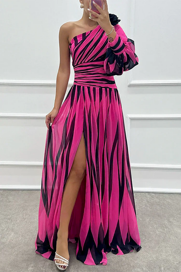 Chic one-shoulder maxi dress with a vibrant print, high slit, and flattering ruched detail for parties.