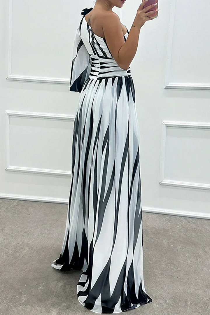 Fashionable wedding guest maxi dress; printed, one-shoulder design. Perfect formal wear for special events.