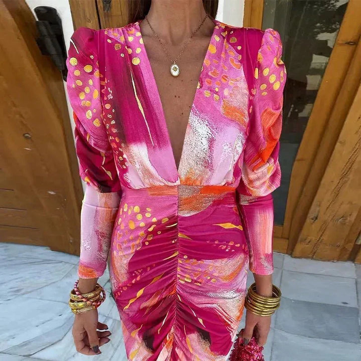 Chic women's printed ruched midi dress, ideal as an elegant wedding guest, cocktail, or evening party outfit.
