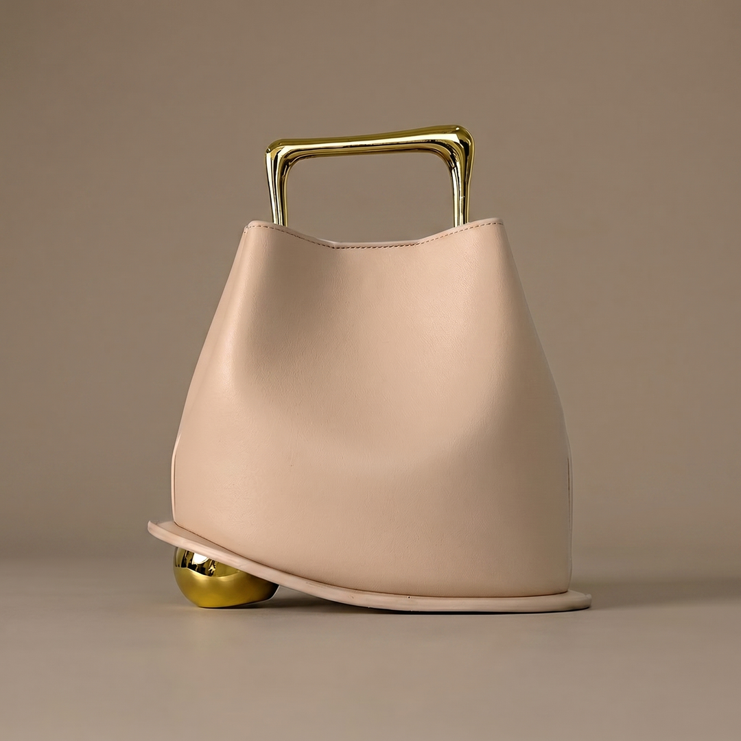 Modern structured PU leather bucket bag for women. Elegant shoulder carry, perfect for versatile everyday luxury style.
