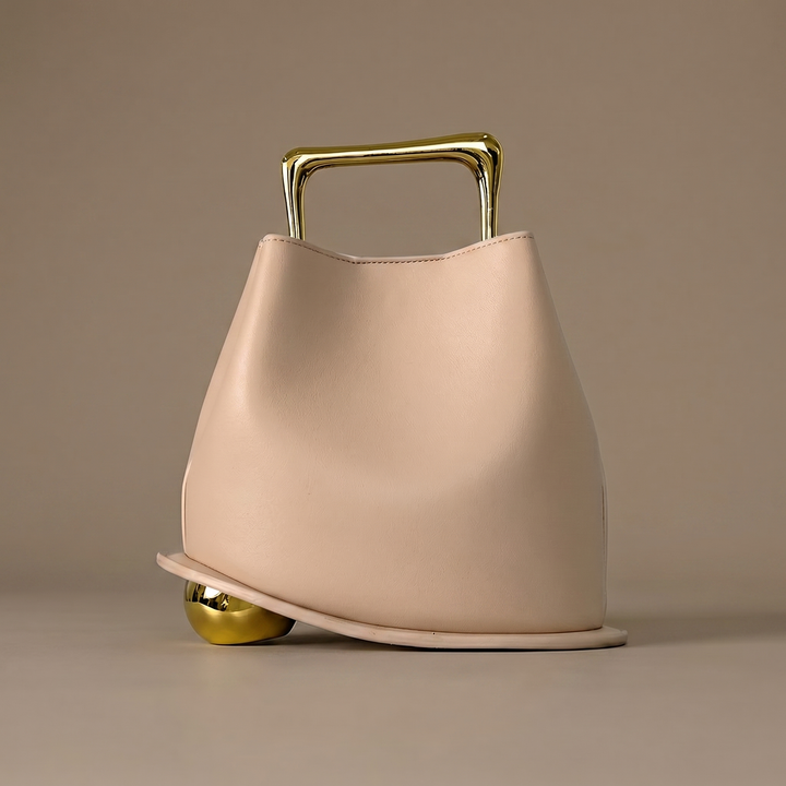Modern structured PU leather bucket bag for women. Elegant shoulder carry, perfect for versatile everyday luxury style.