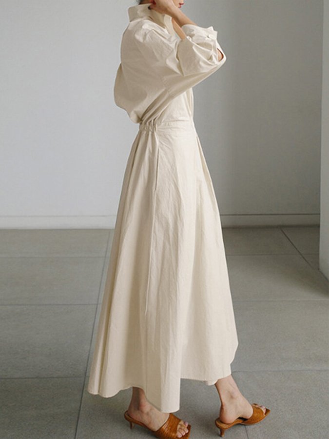 Women's formal elegant maxi dress with stylish puff sleeves and a unique twist waist design.