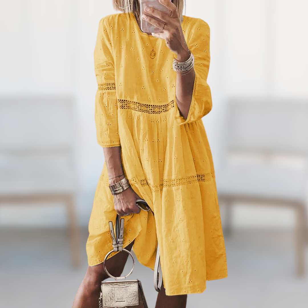 Women's elegant flowy summer dress in a vibrant color, featuring a comfortable round neck, ideal for vacation or casual chic.