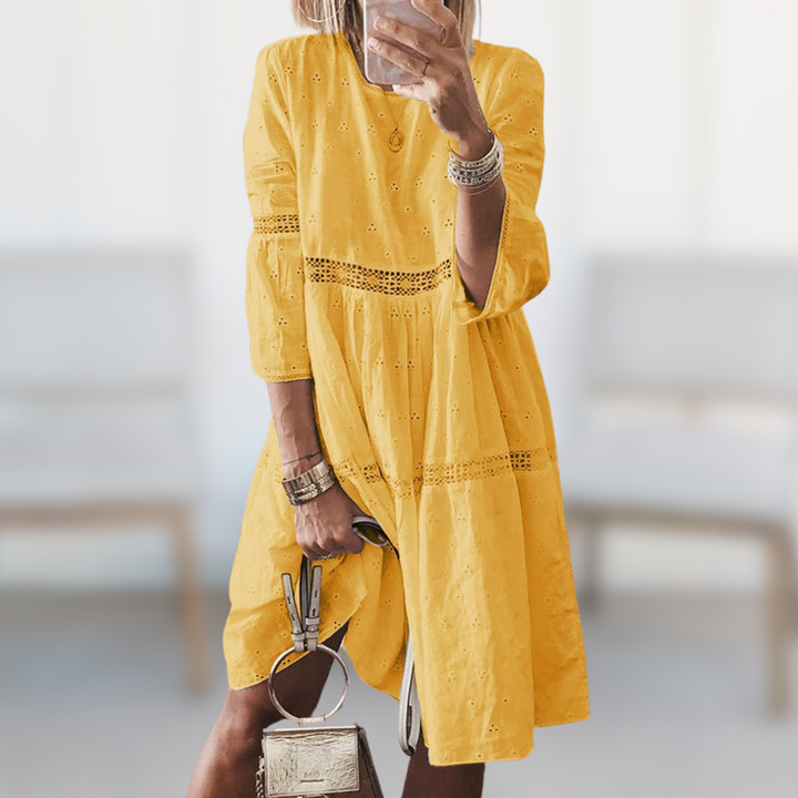 Women's elegant flowy summer dress in a vibrant color, featuring a comfortable round neck, ideal for vacation or casual chic.