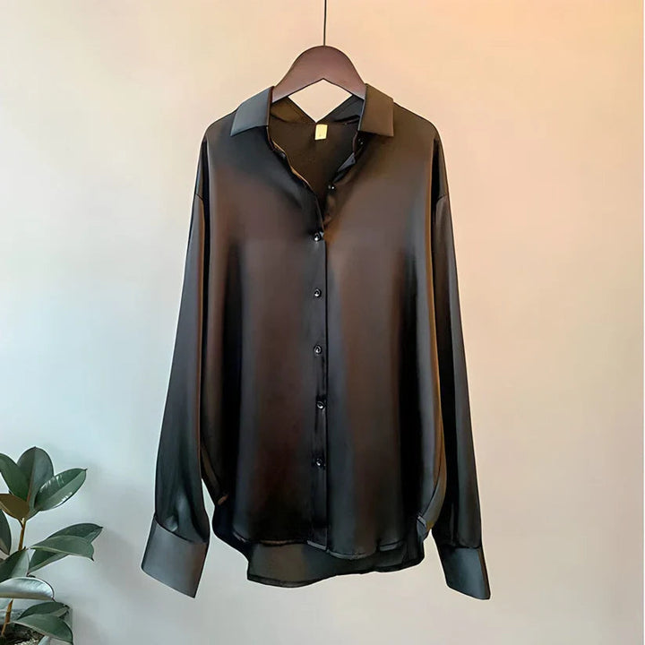 Relaxed oversized long sleeve button down blouse for women. Elegant, comfortable and stylish office wear.