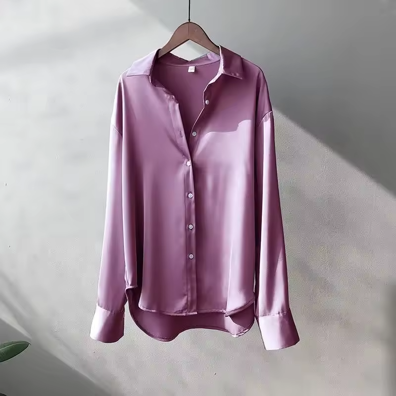Women's fashion long sleeve button down blouse with relaxed elegant fit. Versatile top for modern style.